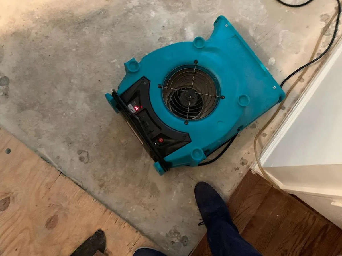 Air mover drying subfloor during Leak Detection & Repair in North Andover